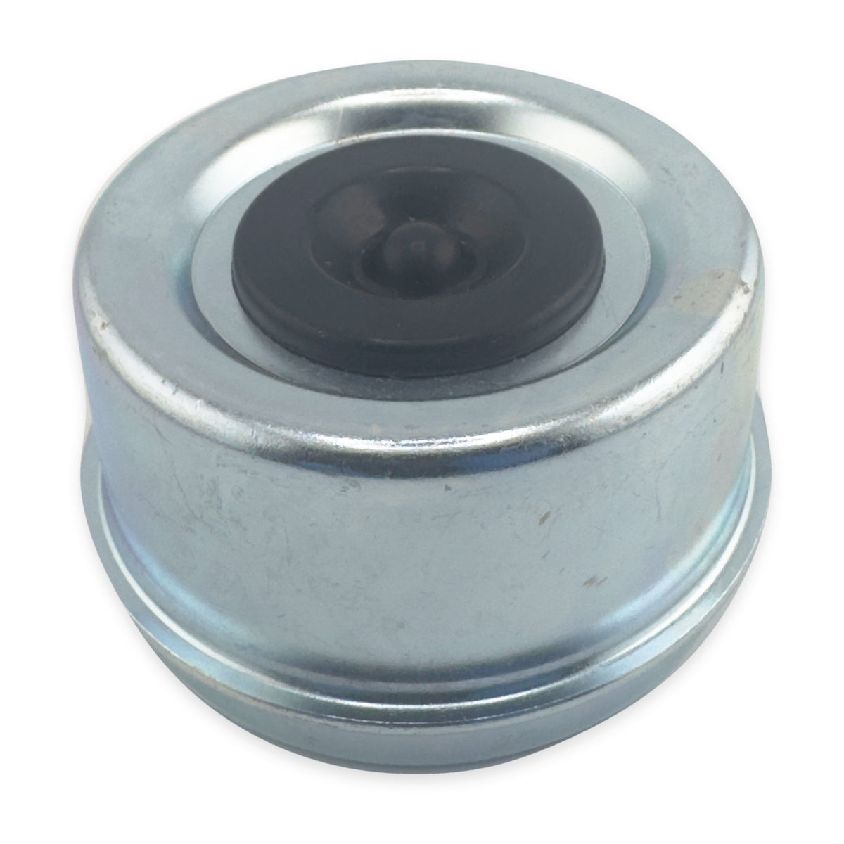 Trailer hub dust cap with the original rubber plug in place