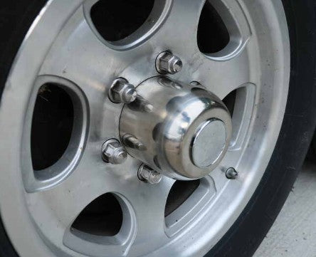 Chrome end cover over a trailer hub, which blocks the iTM signal